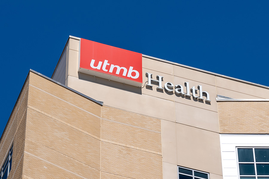 A zoomed in image of a UTMB building displaying the UTMB logo